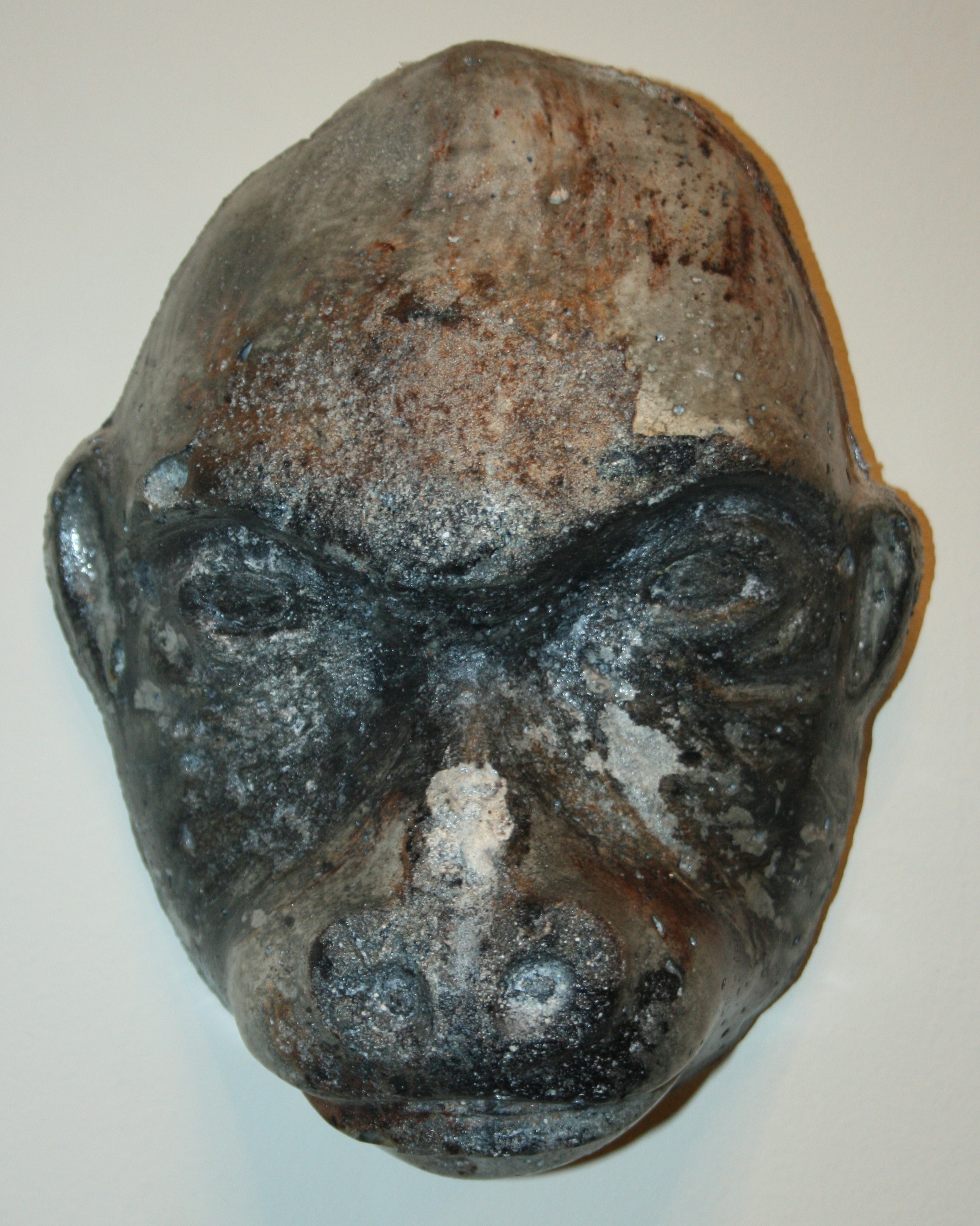 Old gorilla concrete wall sculpture
