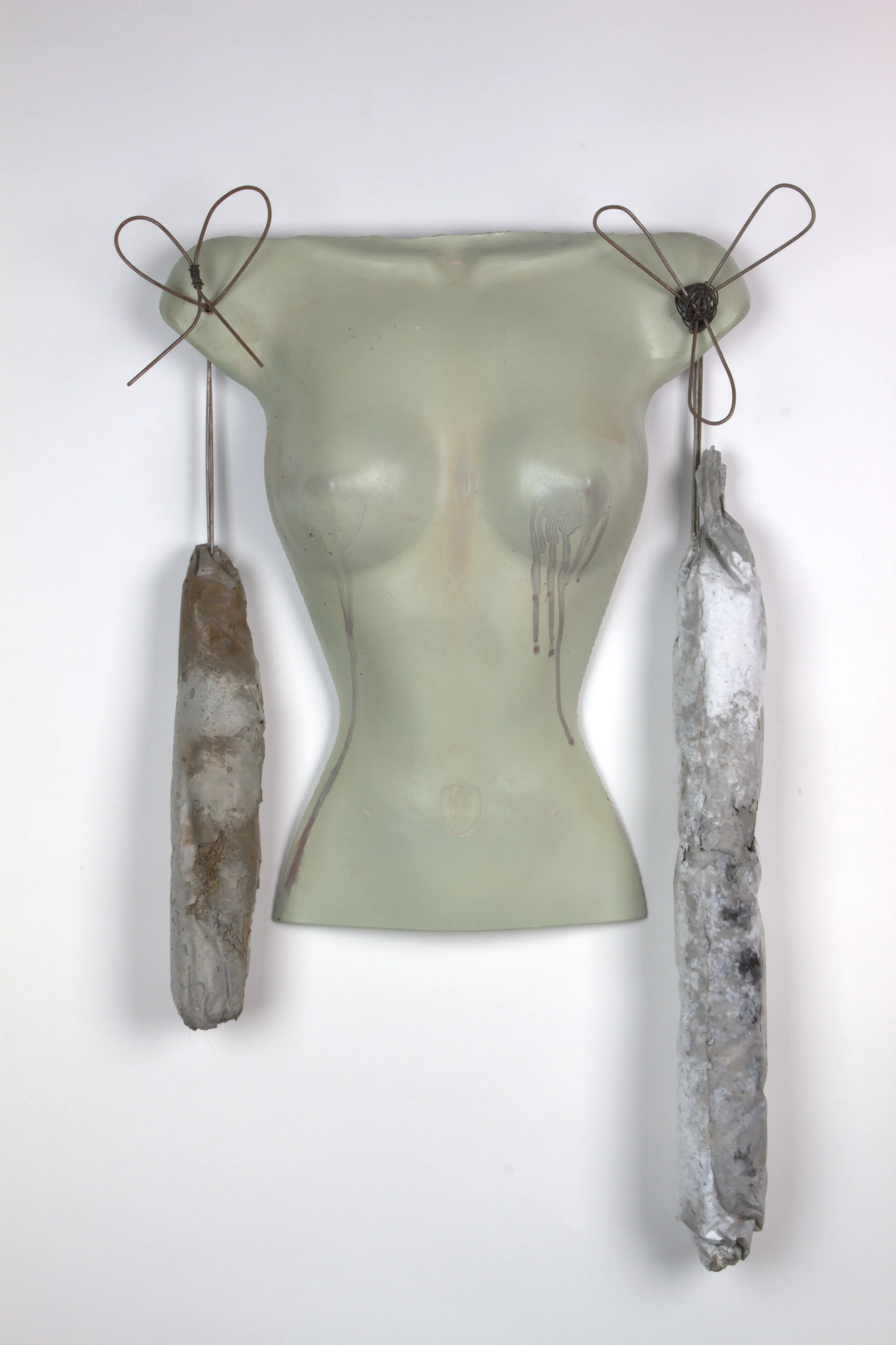 lady bust with metal decorations and concrete meat like arms wall sculpture
